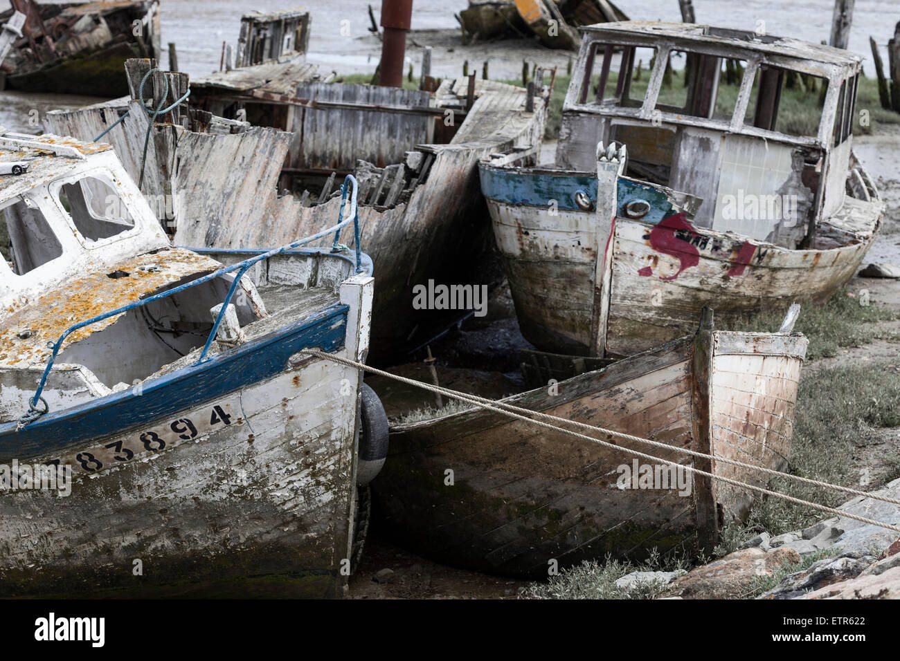 Old fishing boats at low tide at the beach Stock Photo - Alamy