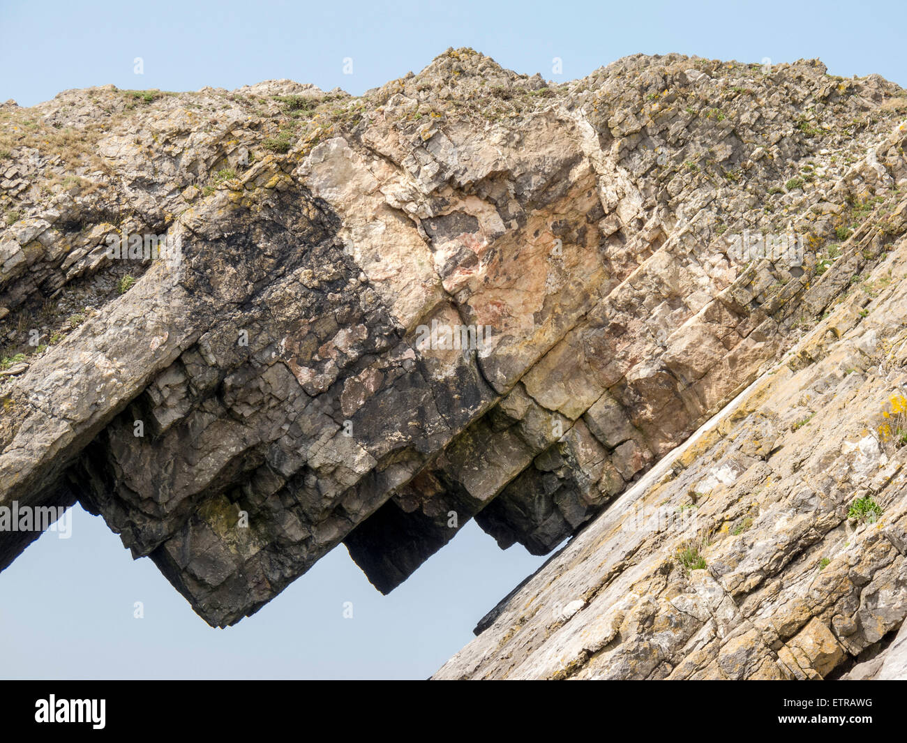 Close up view of the Devil's Bridge on Worm's Head on the Gower Peninsula, Wales showing a split across the strata Stock Photo