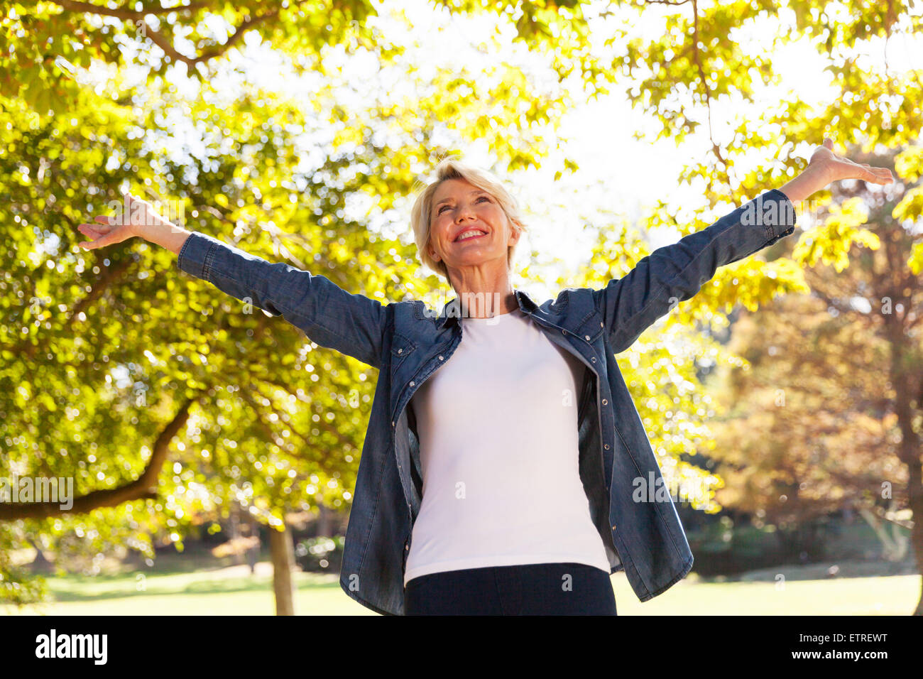 Woman arms outstretched mature hi-res stock photography and images - Alamy