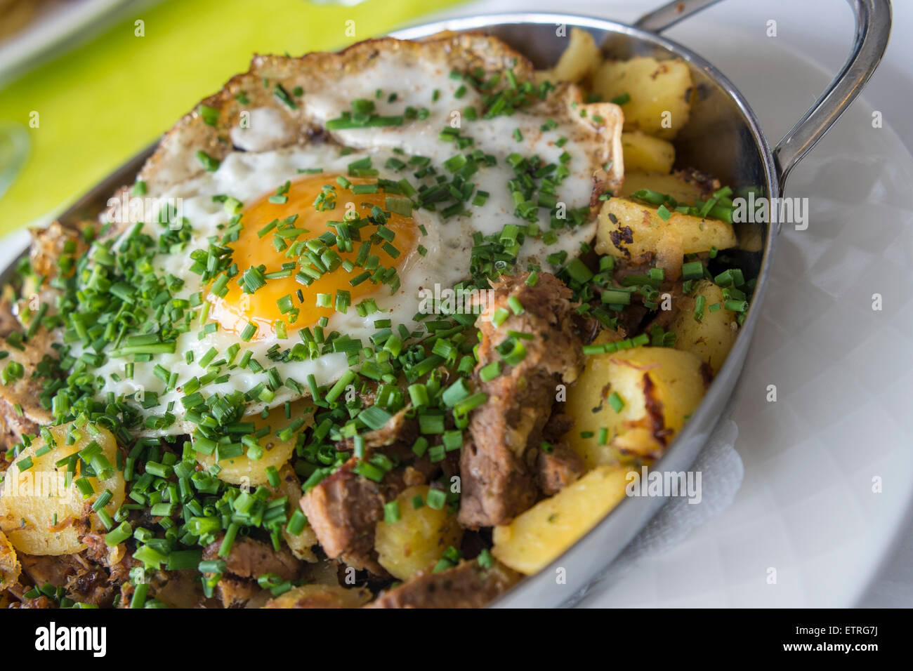 Gröstl mit Spiegelei, traditional food in Innsbruck, Tyrol, Austria ...