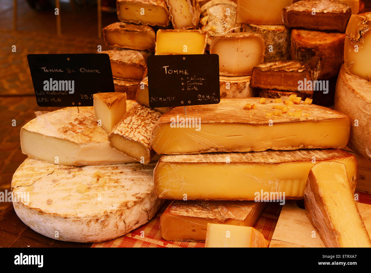 Hand made cheese cheeses on sale at French market in France Stock Photo