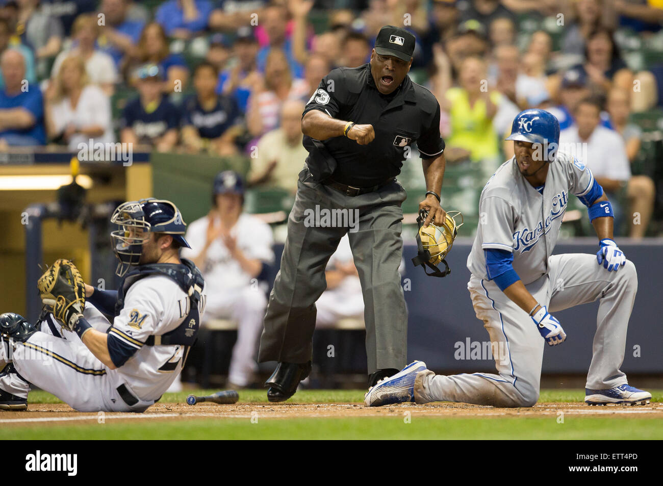 Milwaukee, Wisconsin, USA. 15th June, 2015. Kansas City Royals shortstop Alcides Escobar #2 is first called out by home plate umpire Laz Diaz. After a replay challenge Escobar was called safe during the Major League Baseball game between the Milwaukee Brewers and the Kansas City Royals at Miller Park in Milwaukee, WI. John Fisher/CSM/Alamy Live News Stock Photo
