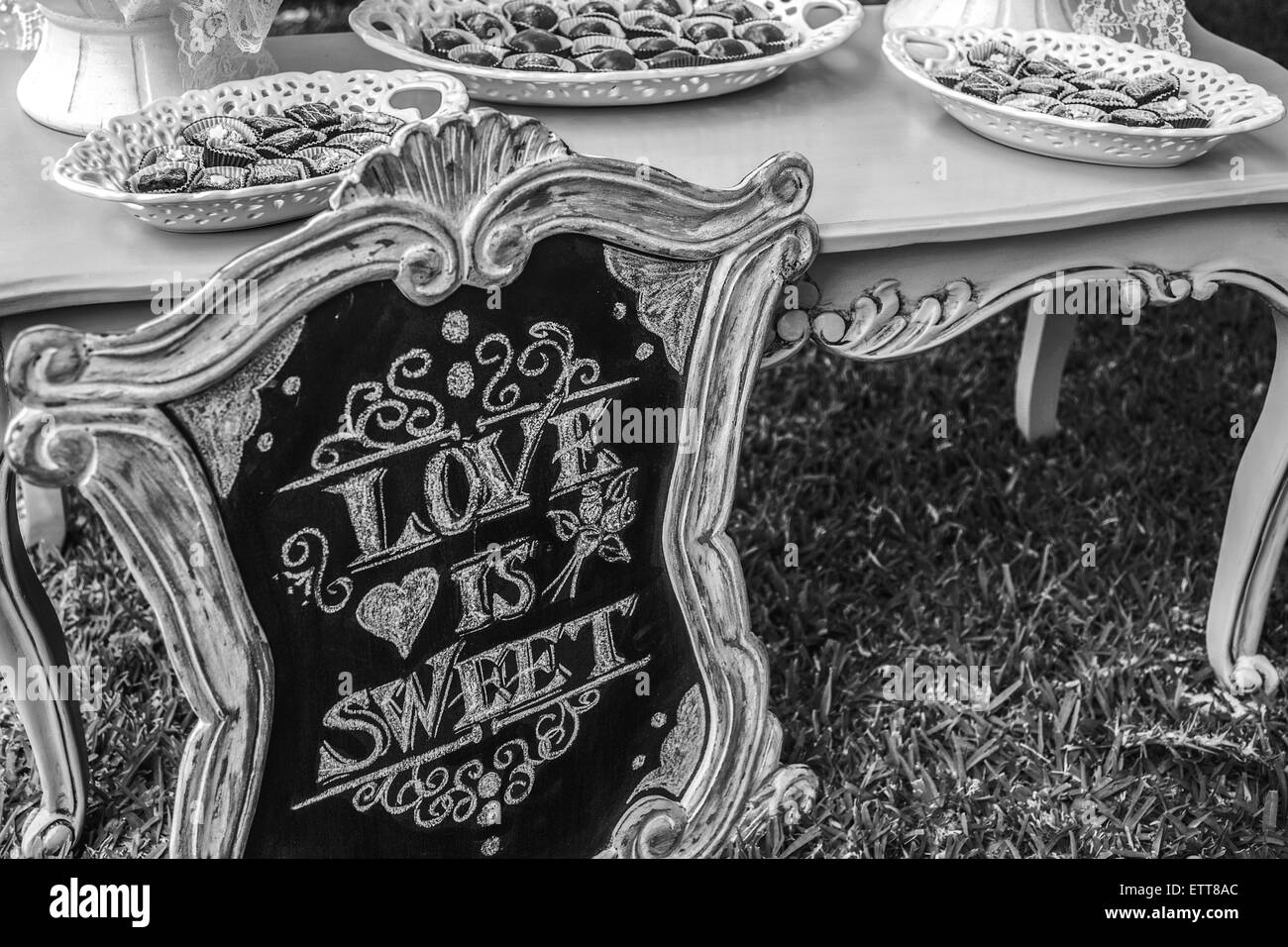 DIY wedding Love is sweet hand written sign Stock Photo