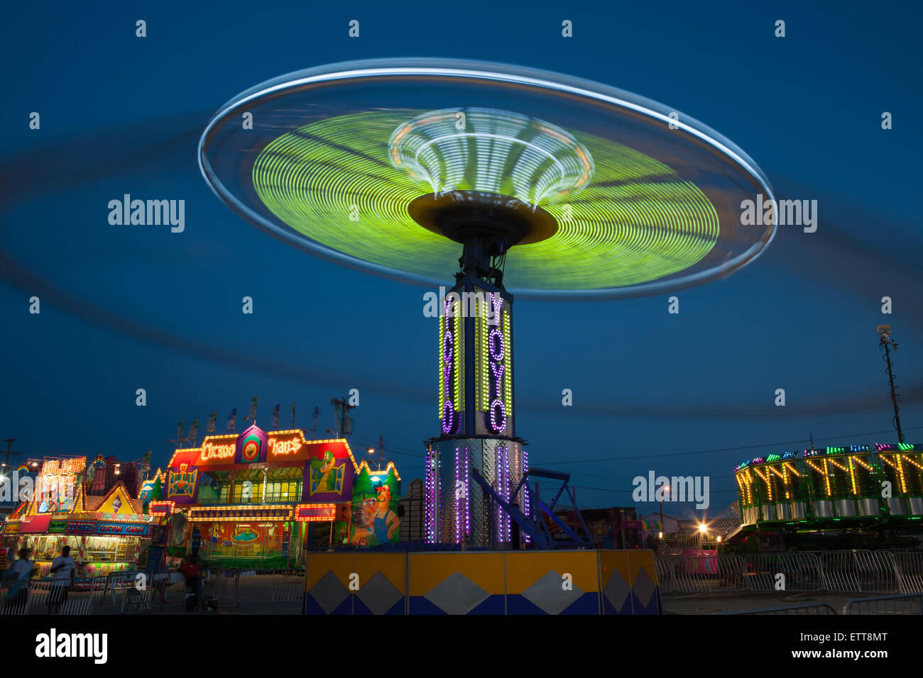 The colorfully illuminated YoYo spins on the midway at the Tennessee
