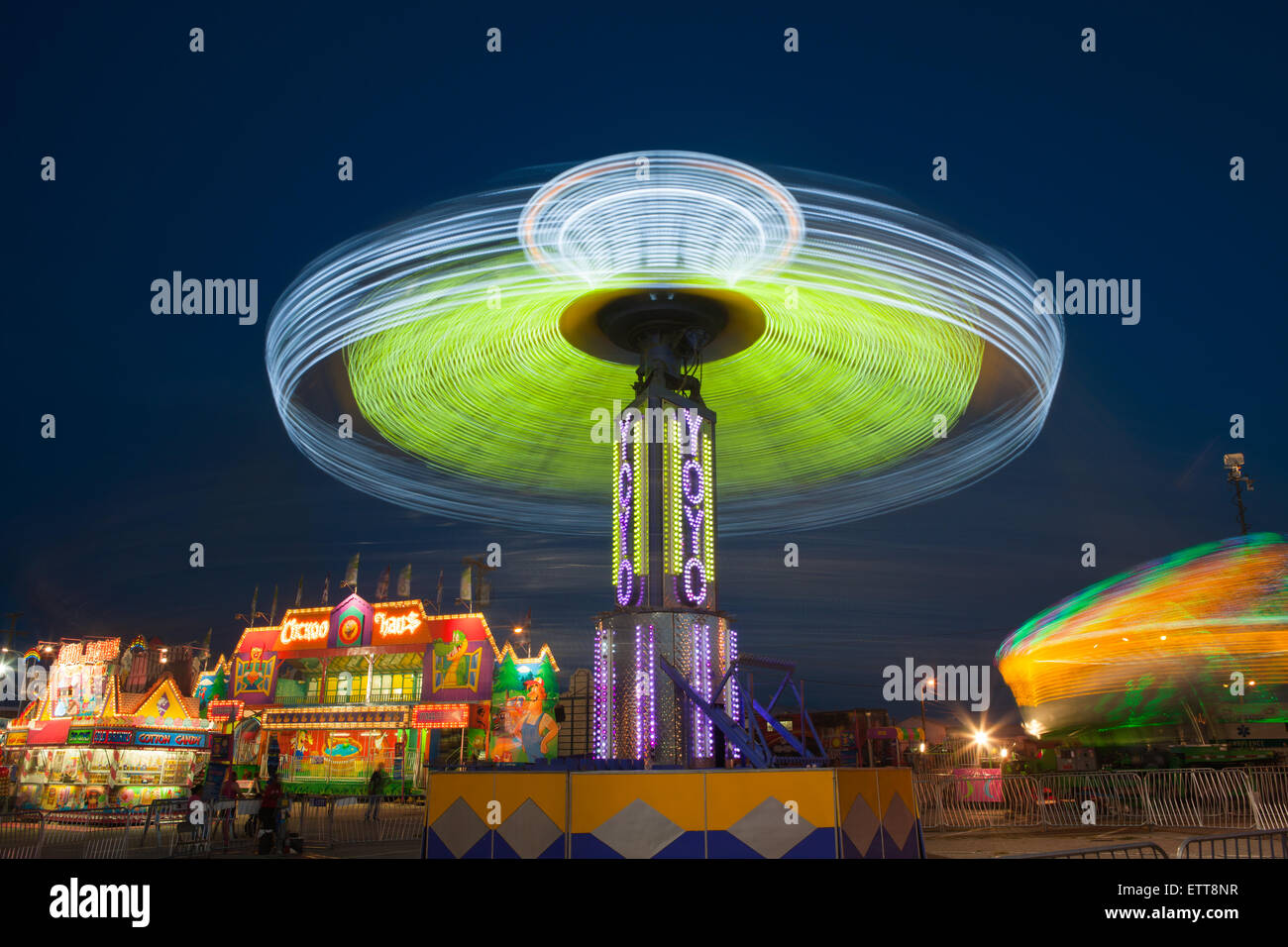 The colorfully illuminated YoYo spins on the midway at the Tennessee