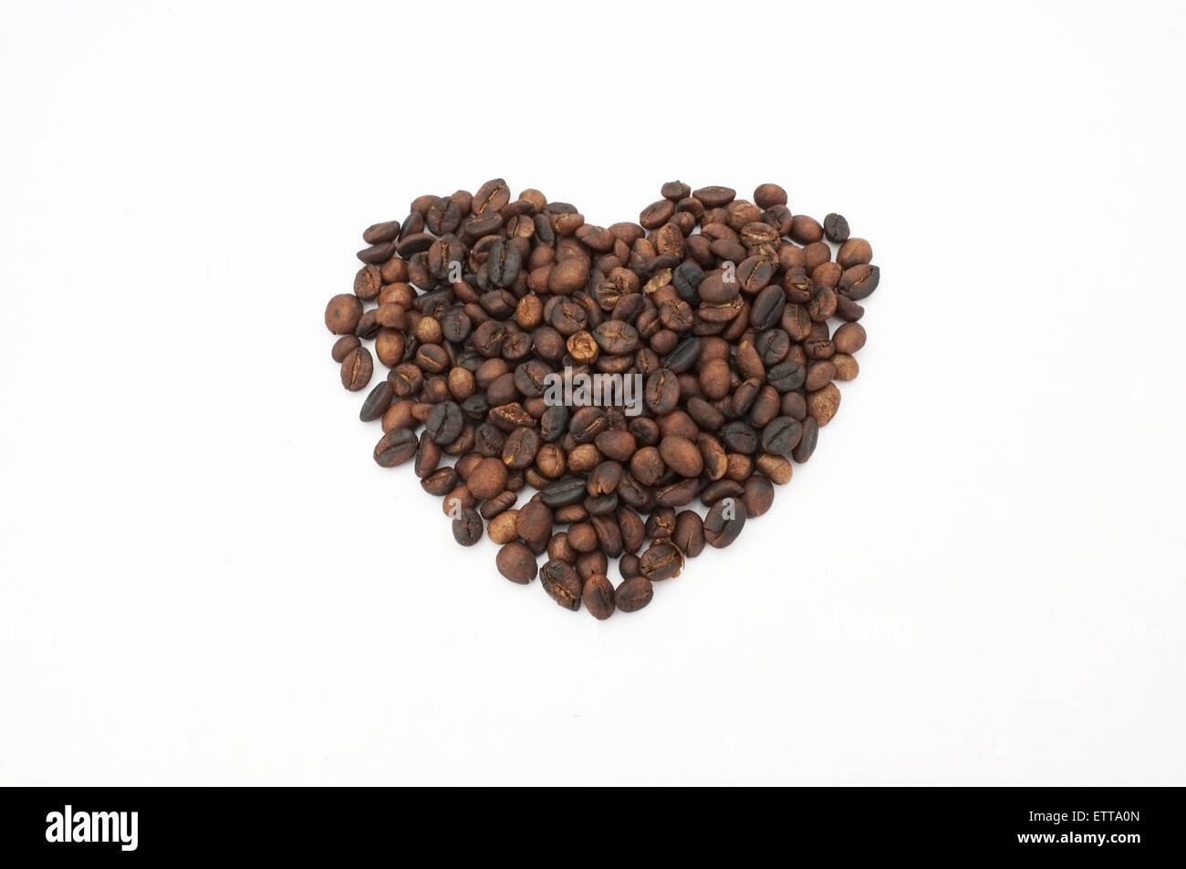 Heart shape coffee beans on white background Stock Photo