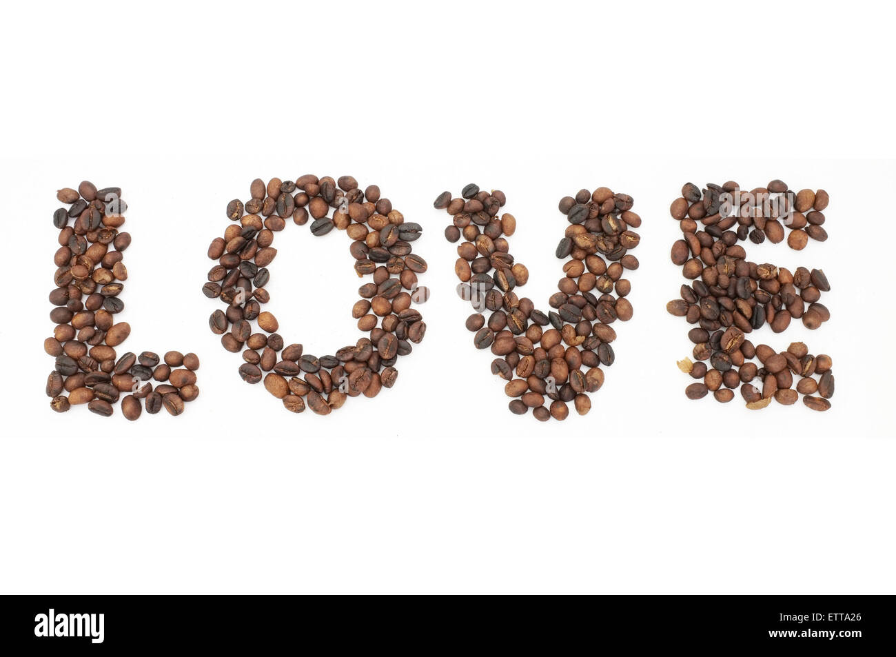 Roasted coffee beans in shape of alphabets, love Stock Photo