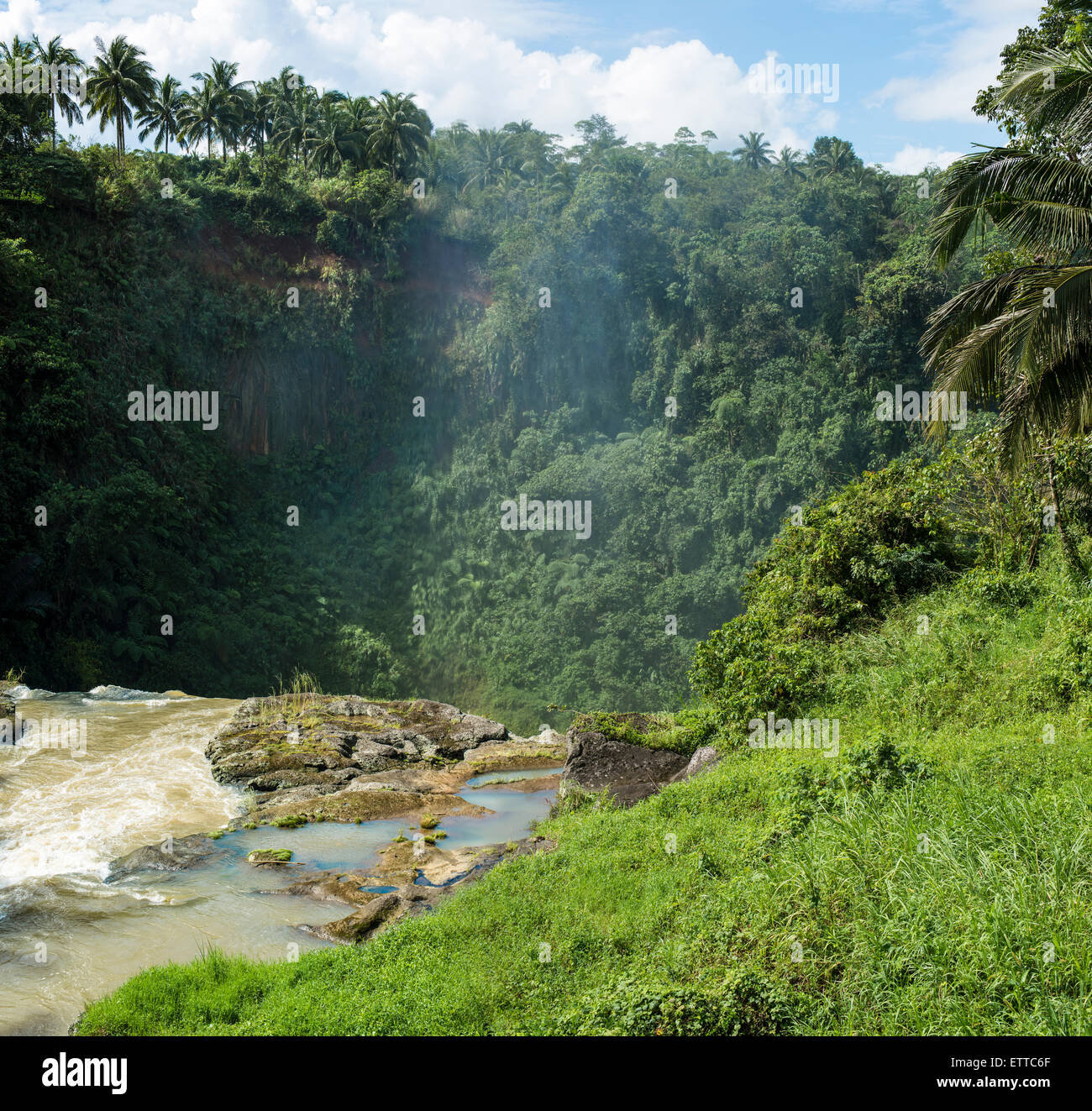 Water dust rising up from the top of Pagsanjan falls in the Philippines Stock Photo