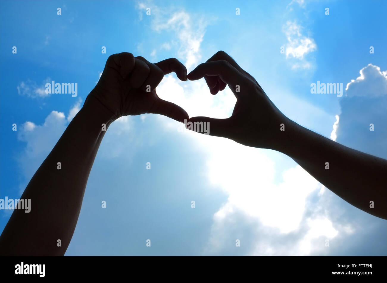 Hands in heart shape over sky Stock Photo - Alamy
