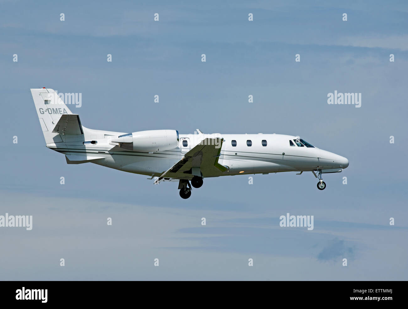 The Cessna Citation XLS 560 G-OMEA on approach to Inverness Airport Scotland.  SCO 9887. Stock Photo