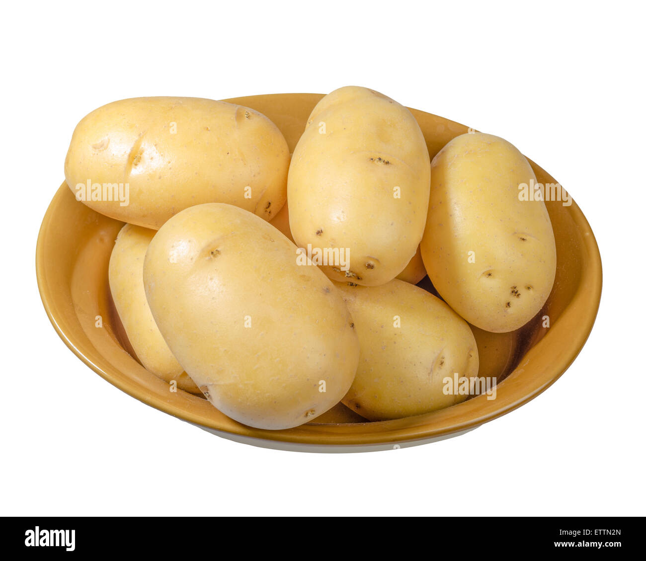 White potatoes fresh picked in a bowl isolated on white Stock Photo