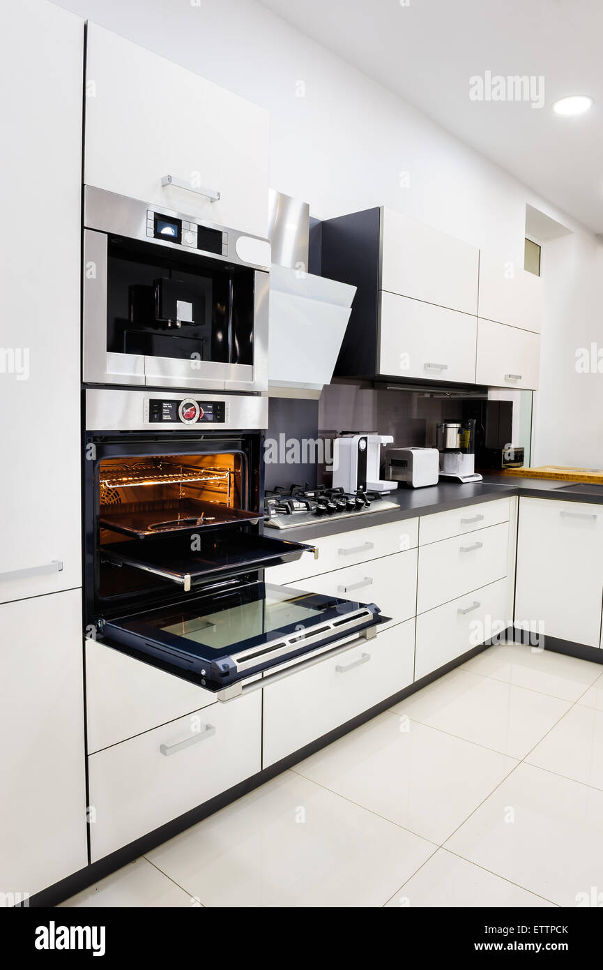 Modern hitek kitchen, oven with door open Stock Photo Alamy