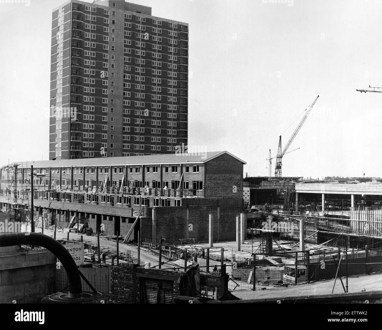 A 22-storey block - shops at ground level and flats above - dominates the scene of more building work in the New Strand shopping centre at Bootle. 19th June 1967. Stock Photo
