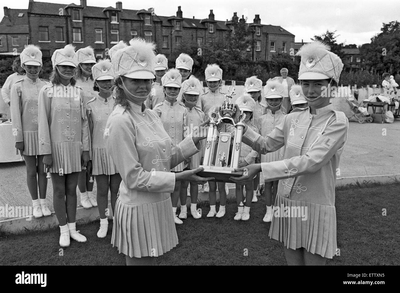 Stepping high... Davina Beckwith, left, and Susan Price, watched by other majorettes from paddock limelight's, display the trophy won by the troop at the Yorkshire carnival association's gala. It went on show when the majorettes held a gala at paddock cricket club which raised £226 towards a trip to Bridlington for a contest in October. 21st August 1988. Stock Photo