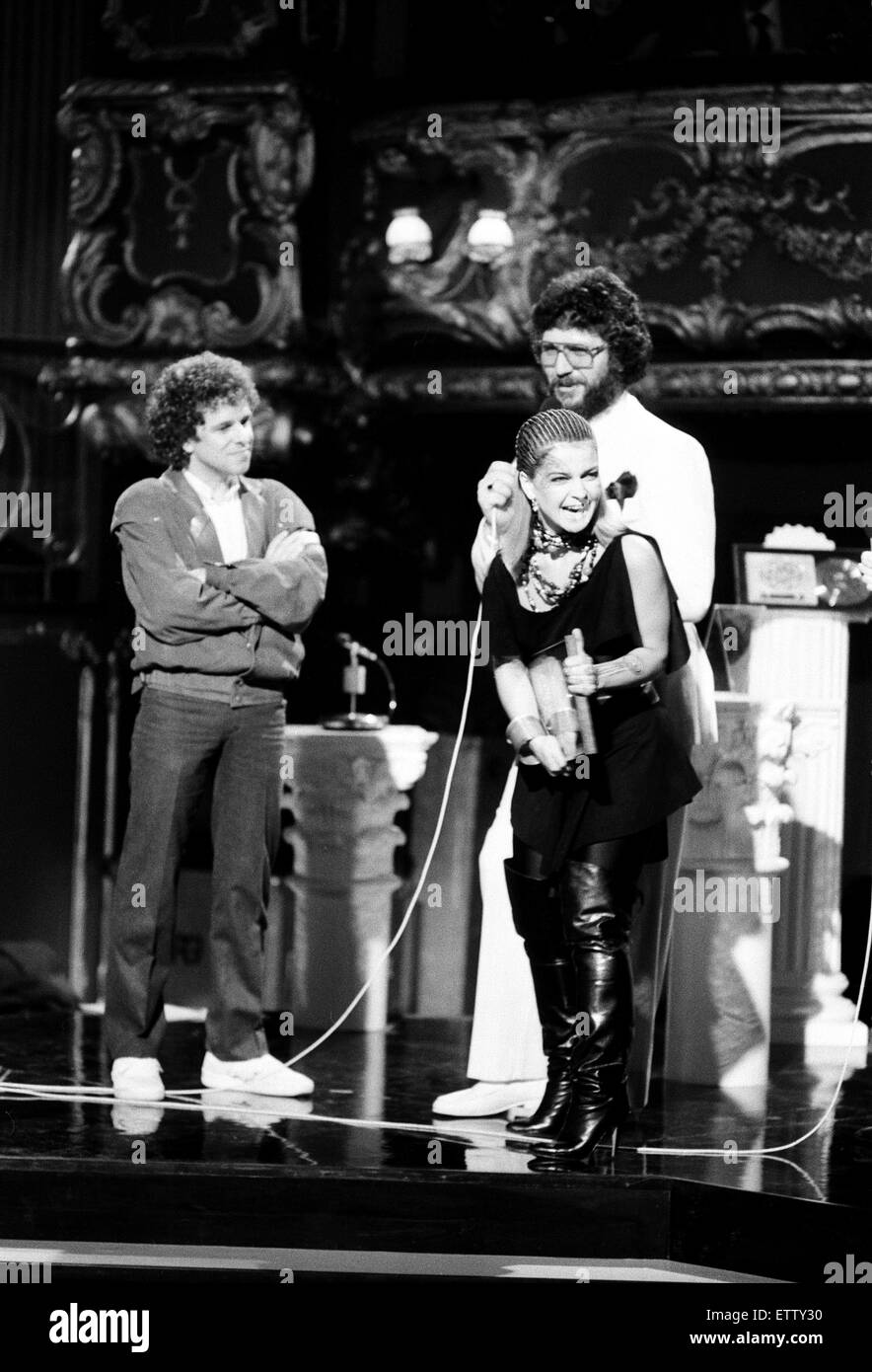 Daily Mirror British Rock & Pop Awards at The Lyceum, London. Toyah Willcox receiving 'Best Female Singer of 1981' award. Pictured on stage with Leo Sayer and Dave Lee Travis. 23rd February 1982. Stock Photo