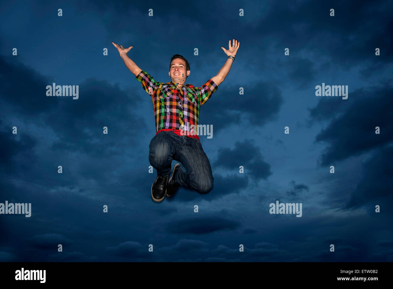 Young Latin man jumping Stock Photo Alamy