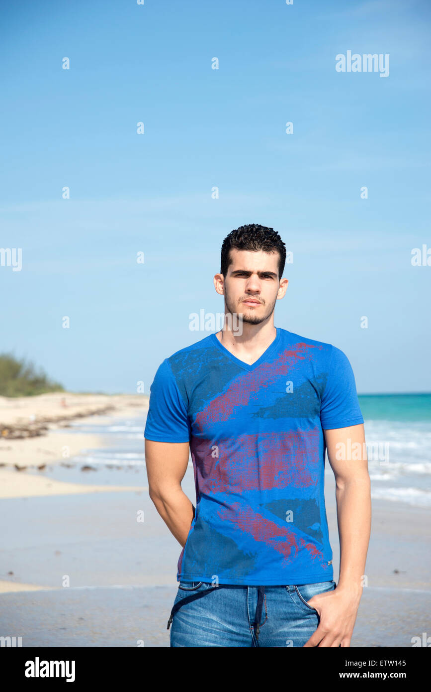 Young man on beach Stock Photo