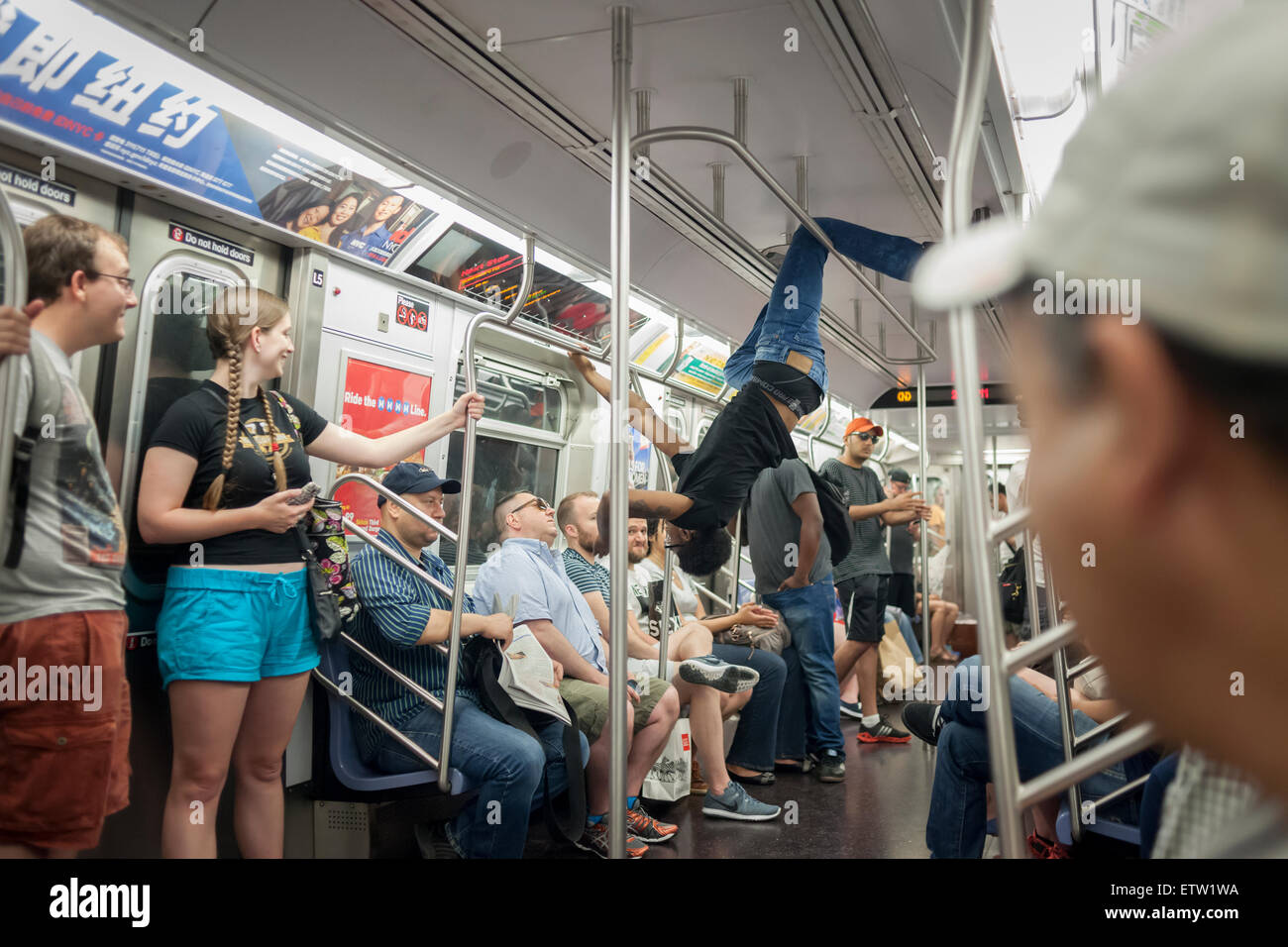 Subway acrobats perform for riders in New York on Saturday, June 13, 2015. (© Richard B. Levine) Stock Photo