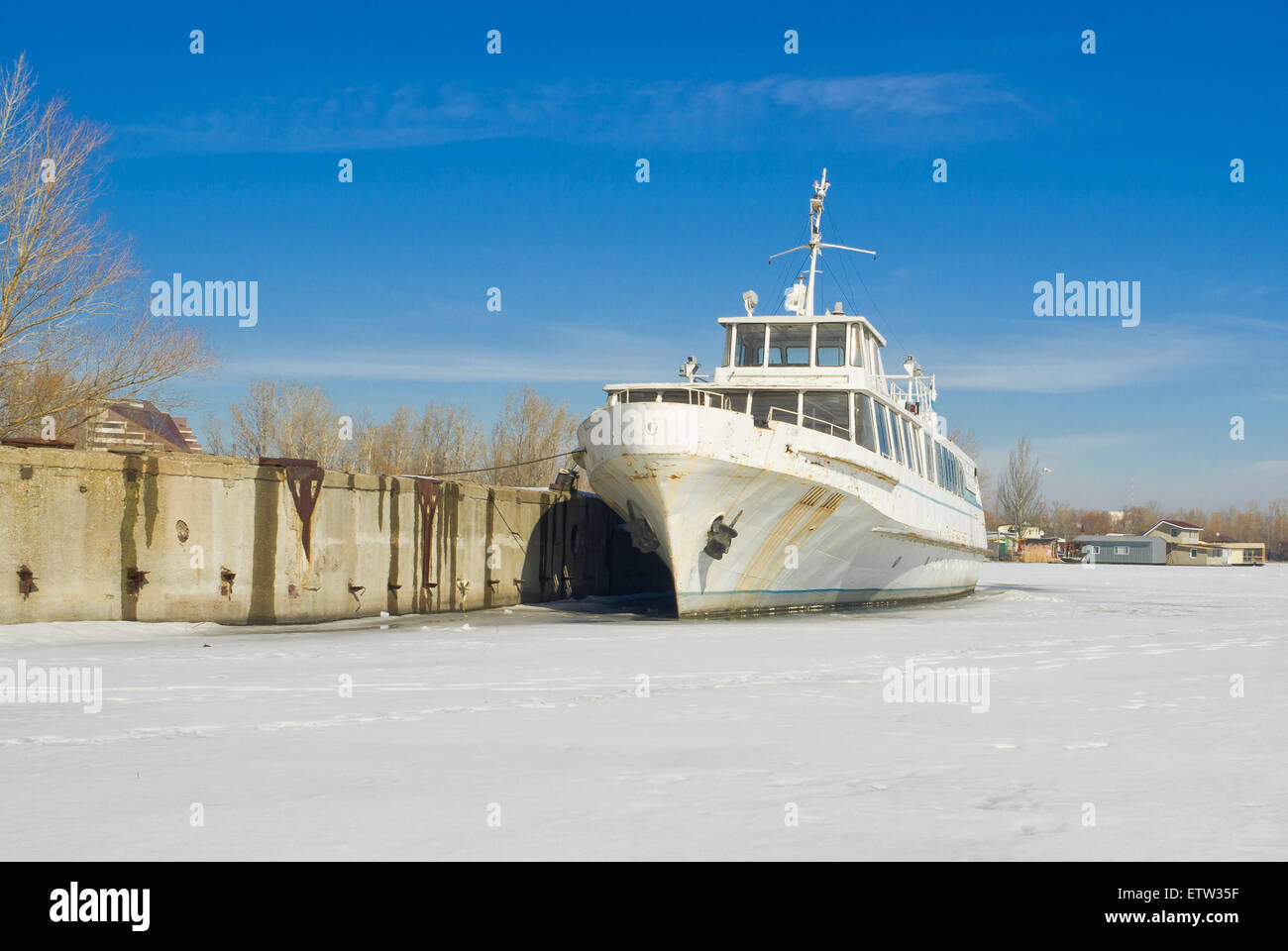 Retired pleasure boat on a winter berthing. Stock Photo
