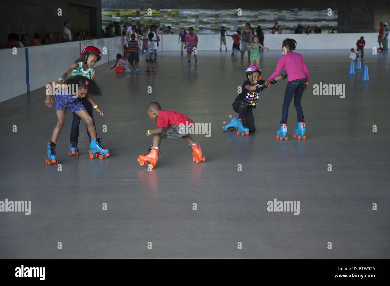 Children learn to roller skate at the Lakeside Rink in Prospect Park