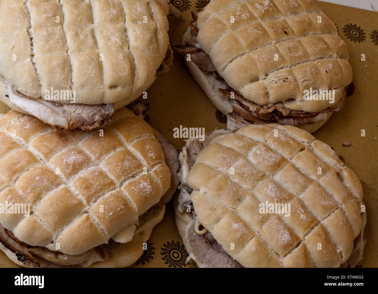 four sandwiches with italian porchetta, ready for eating Stock Photo