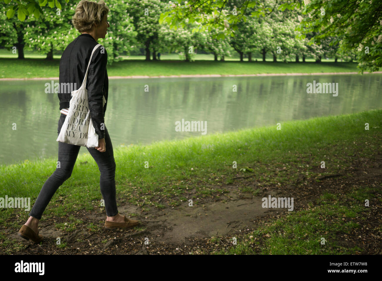 Woman walking park alone hi-res stock photography and images - Alamy