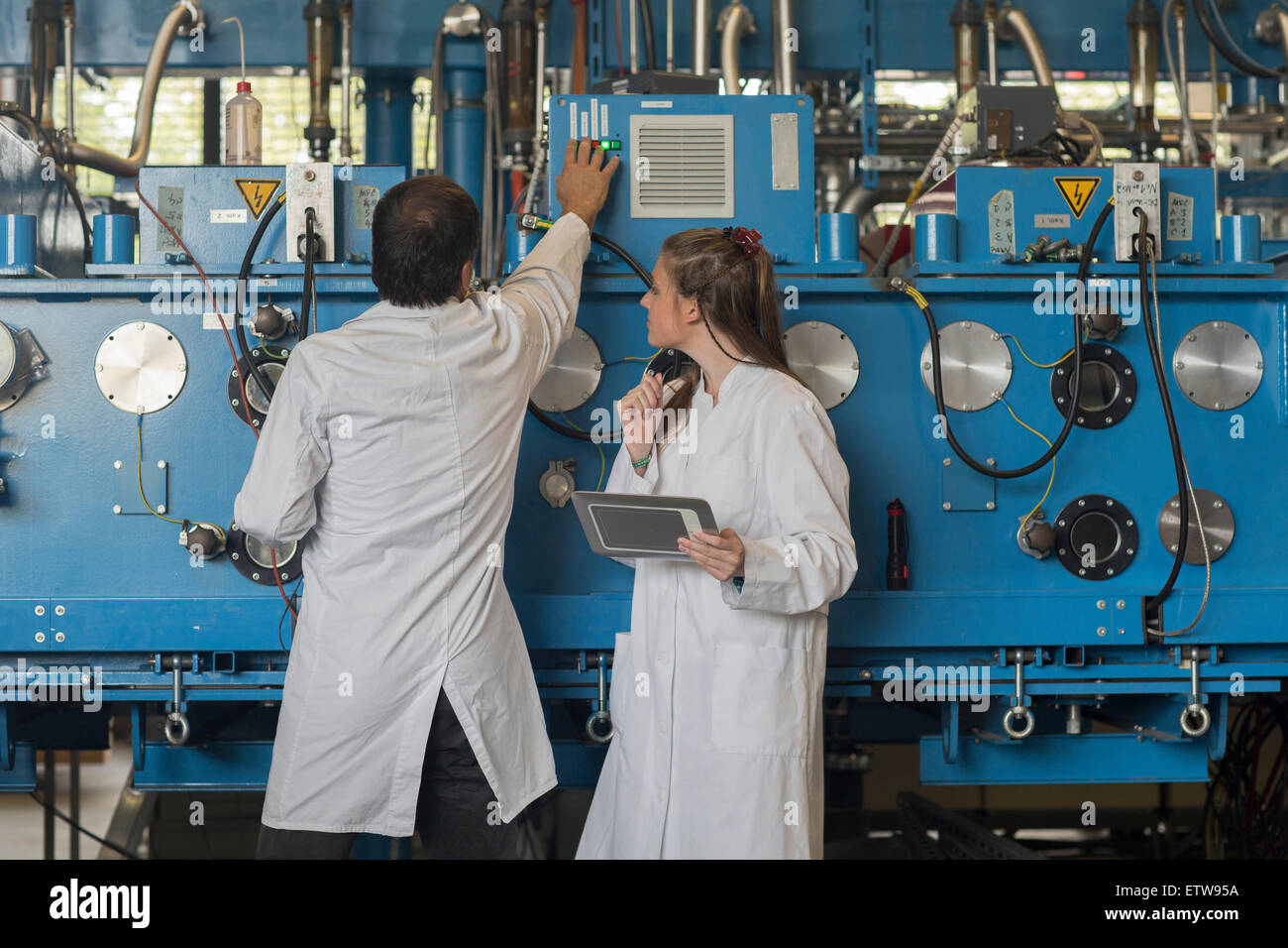 Controlling Machine Controlling man woman hi-res stock photography and images - Alamy