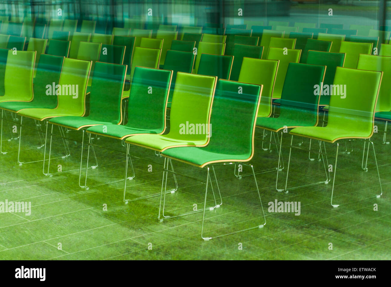 Chairs in a conference room, seeing through glass pane Stock Photo Alamy