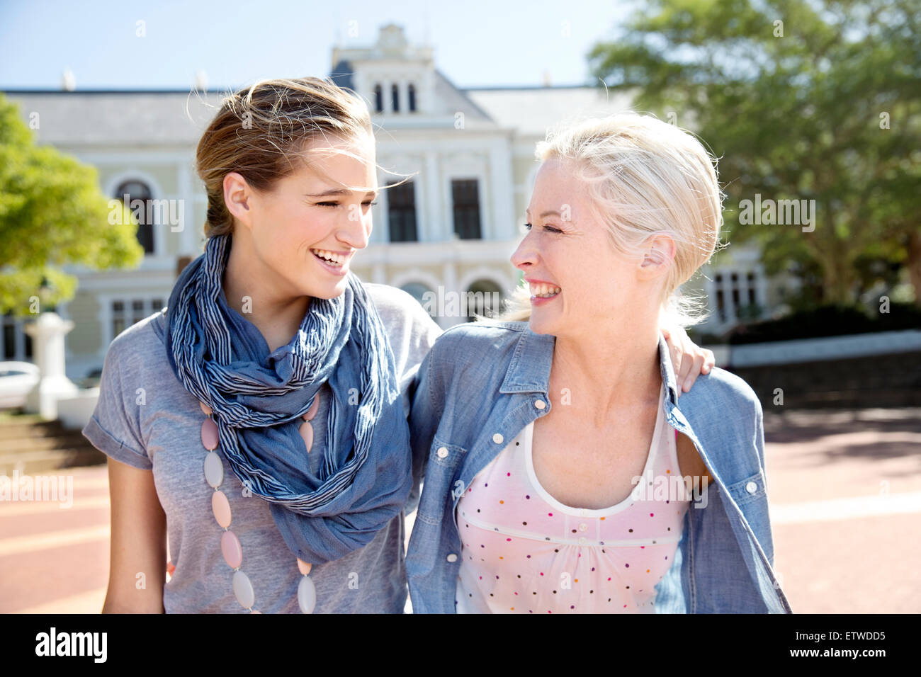 Two happy young women outdoors Stock Photo - Alamy