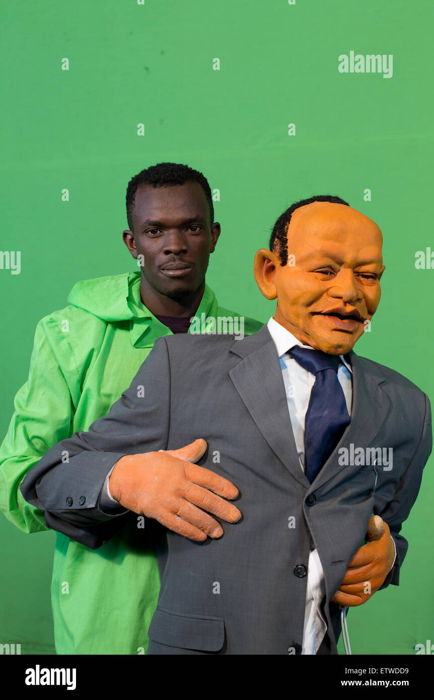 Puppeteer Victor Otieno pose with a puppet at the GoDown Arts Centre , 26 February 2013 where the satirical television program, The XYZ Show is produced. A satirical television program, The XYZ Show comments on current political and social affairs in Kenya through the use of latex puppets resembling prominent figures.On The XYZ Show, national leaders in Kenya are lampooned with the purpose of using humour to address difficult and controversial national issues while promoting transparency in government.  The XYZ Show is modelled after the UKÕs ÒSpitting ImageÓ and FranceÕs ÒLes Guignols de LÕIn Stock Photo