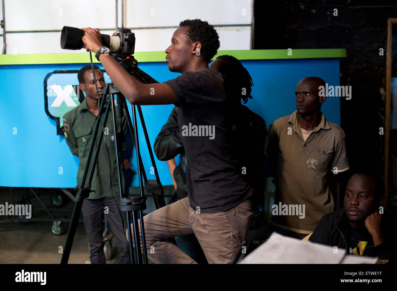 The crew use DSLR camera's  at the GoDown Arts Centre , 26 February 2013 where the satirical television program, The XYZ Show is produced. A satirical television program, The XYZ Show comments on current political and social affairs in Kenya through the use of latex puppets resembling prominent figures.On The XYZ Show, national leaders in Kenya are lampooned with the purpose of using humour to address difficult and controversial national issues while promoting transparency in government.  The XYZ Show is modelled after the UKÕs ÒSpitting ImageÓ and FranceÕs ÒLes Guignols de LÕInfoÓ television  Stock Photo