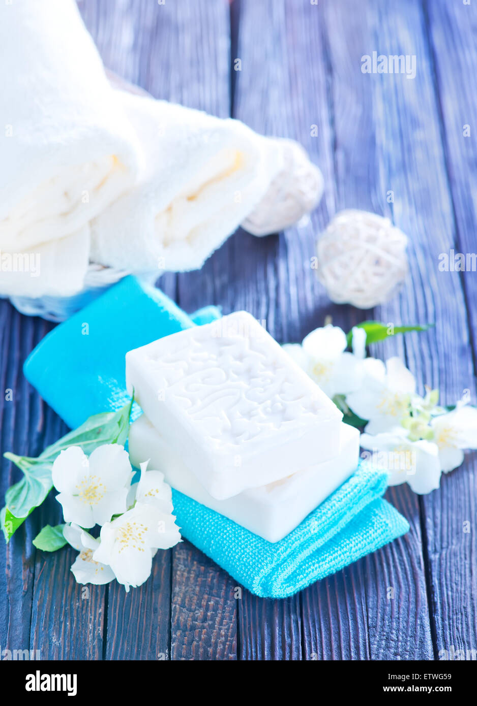 white soap and towels on a table Stock Photo - Alamy