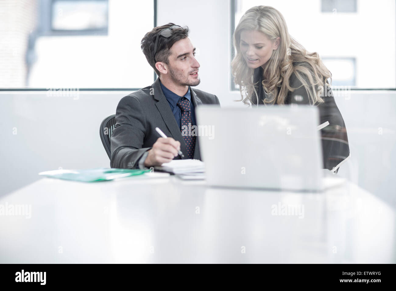 Businessman and businesswoman having an office meeting Stock Photo - Alamy