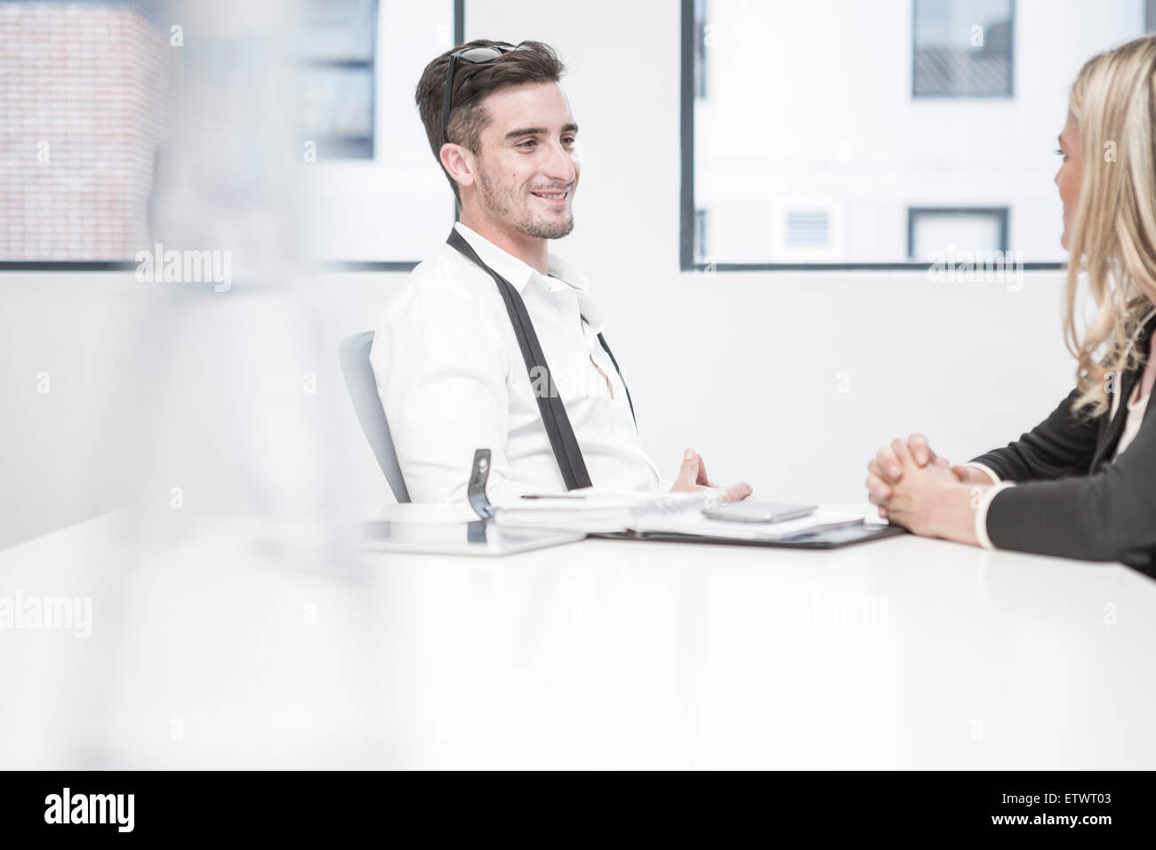 Businessman and businesswoman having an office meeting Stock Photo - Alamy