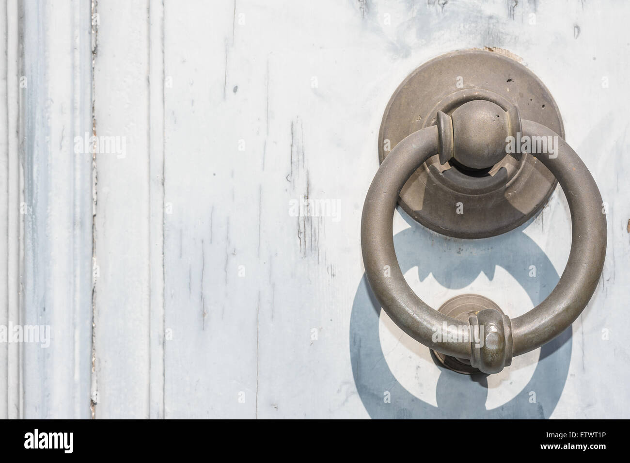 Old wooden door with ring knockers, of brass Stock Photo