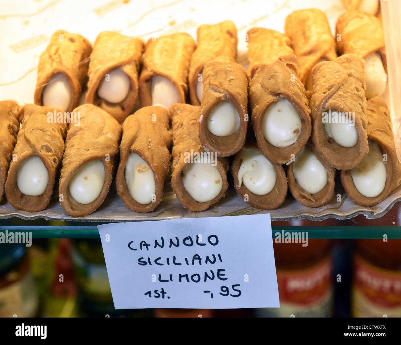 'Cannoli Siciliani al limone', sweet pieces with lemon flavour from Italy, are on sale in the delicatessen shop 'Salumeria Trecolori' for 95 Cent per piece in Berlin Zehlendorf, Germany, 04 June 2015. The pastry is a speciality from Sicily. Photo: Jens Kalaene/dpa Stock Photo