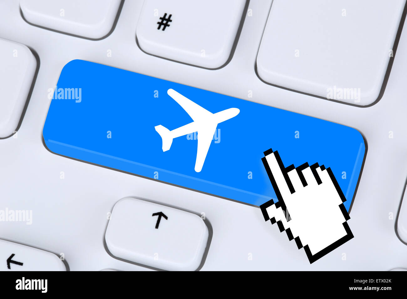 Booking flight and holidays online internet travel shop on computer Stock Photo