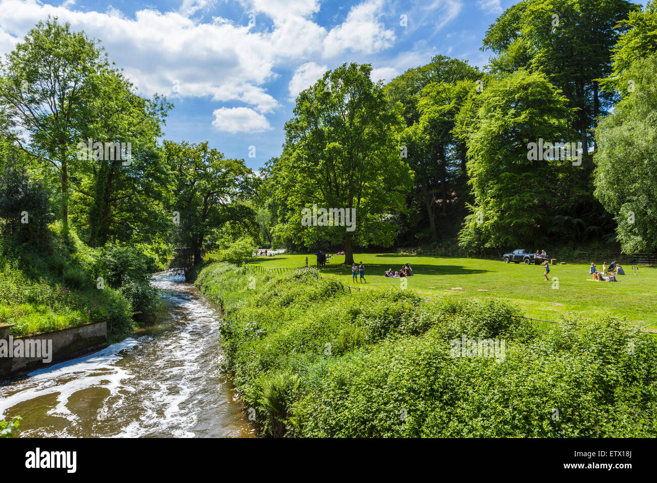 River Bollin in the grounds at Quarry Bank Mill, a historic 18thC textile mill in Styal, Cheshire, England, UK Stock Photo