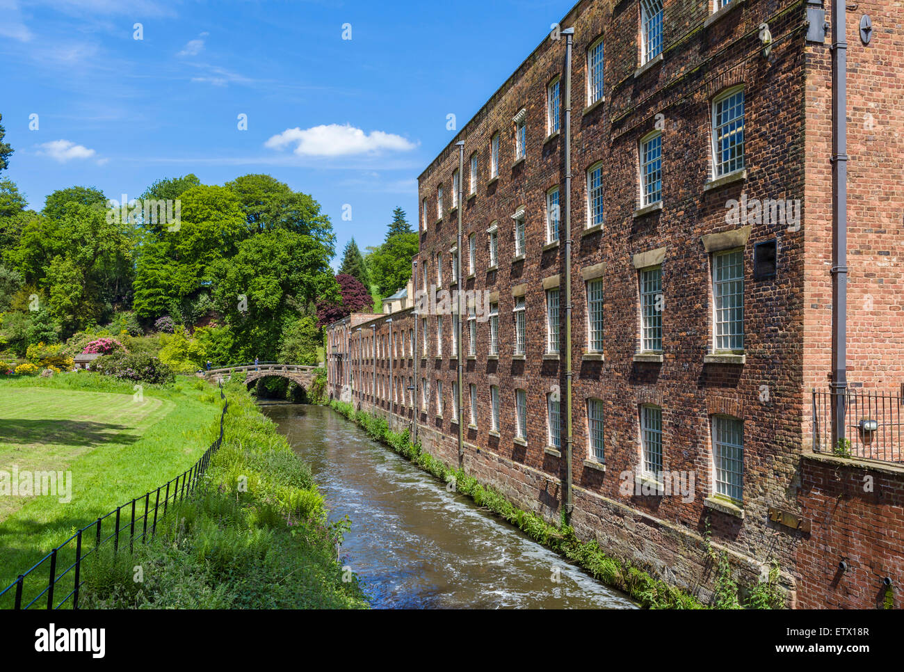 The River Bollin and Quarry Bank Mill, a historic 18thC textile mill in Styal, Cheshire, England, UK Stock Photo