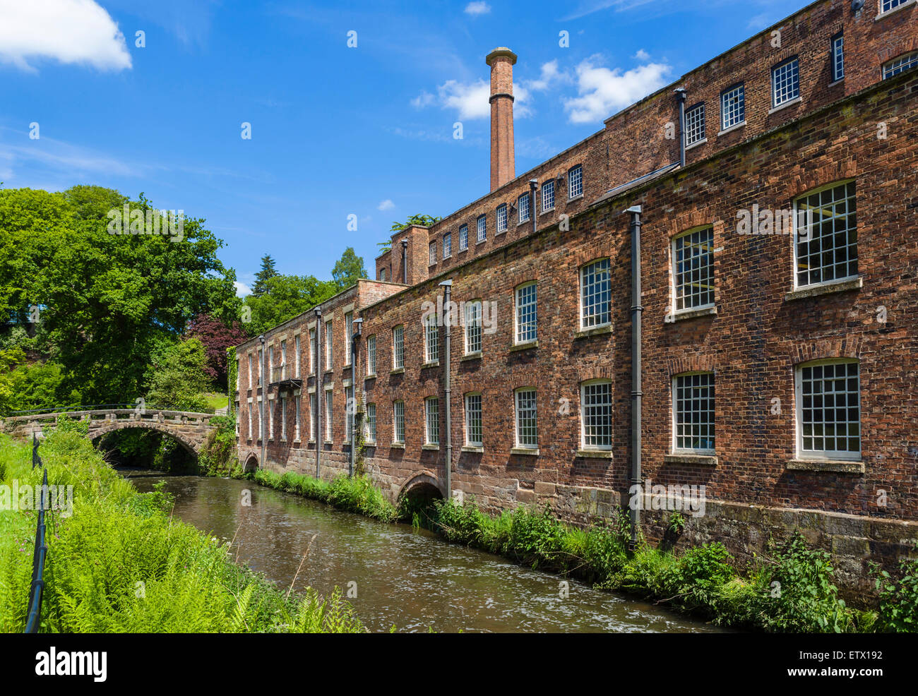 The River Bollin and Quarry Bank Mill, a historic 18thC textile mill in Styal, Cheshire, England, UK Stock Photo