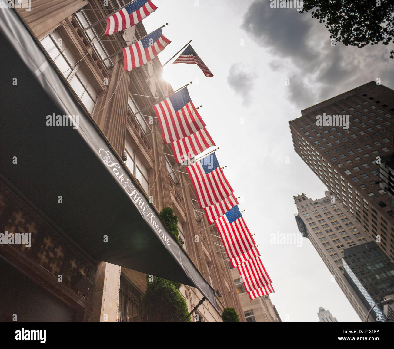 The Saks Fifth Avenue flagship store in New York on Thursday, June 11, 2015. Hudson's Bay, the Canadian owner of Saks and Lord & Taylor, reported a first-quarter loss of CA $54 million citing administrative expenses and costs related to sales. The Saks division rose 0.6 % while its outlet brand OFF 5th  rose 10.3 %. (© Richard B. Levine) Stock Photo