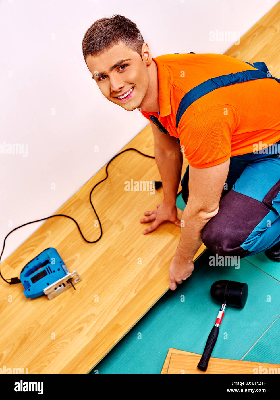 Men laying parquet at home Stock Photo