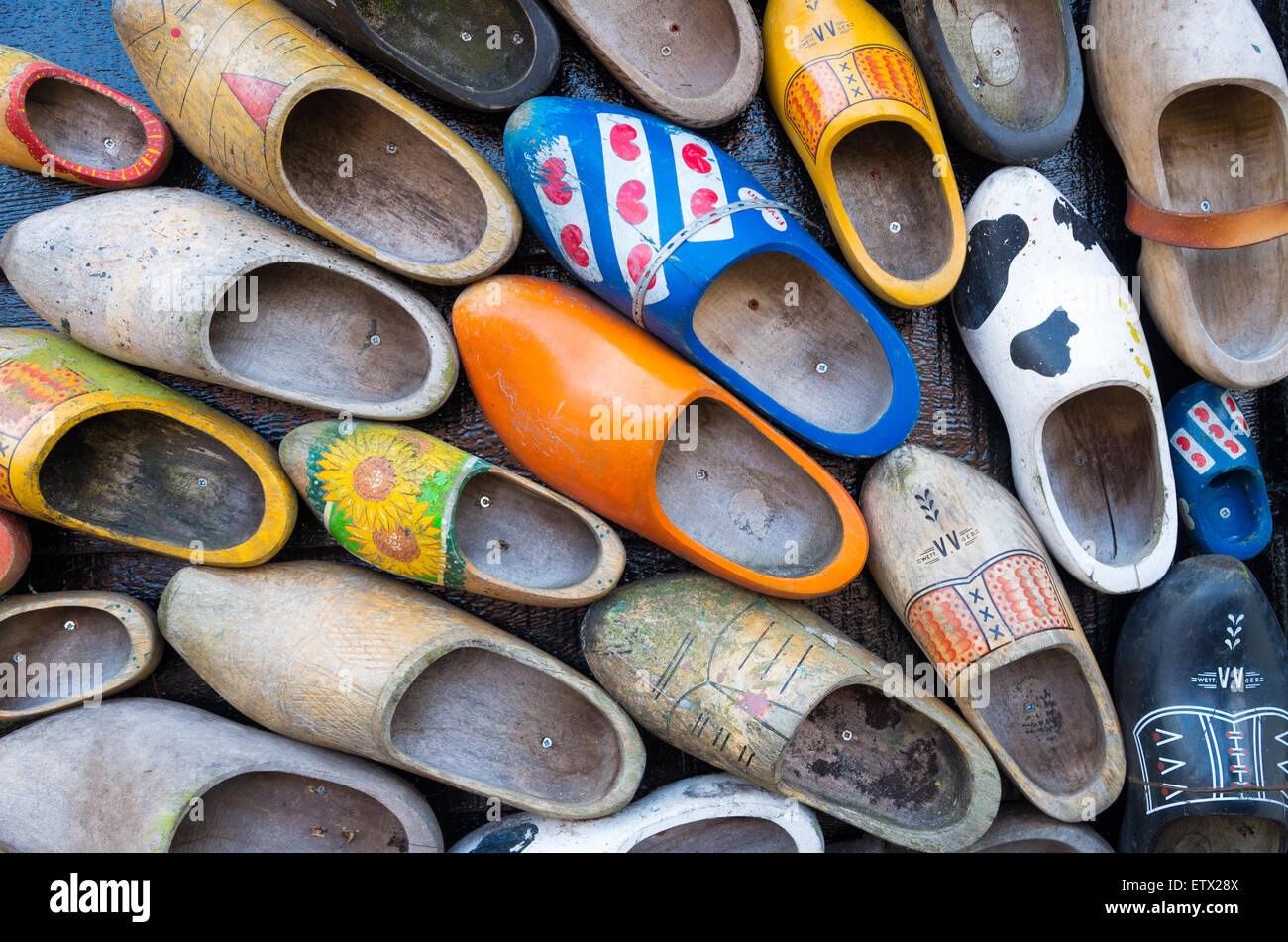 traditional dutch wooden shoes hanging on a wall as decoration Stock Photo