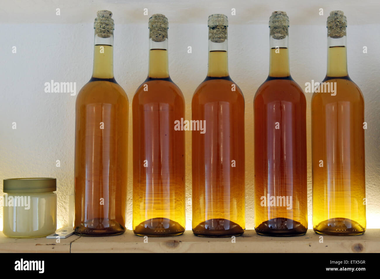 Briescht, Germany, glass with honey and bottles of mead Stock Photo Alamy