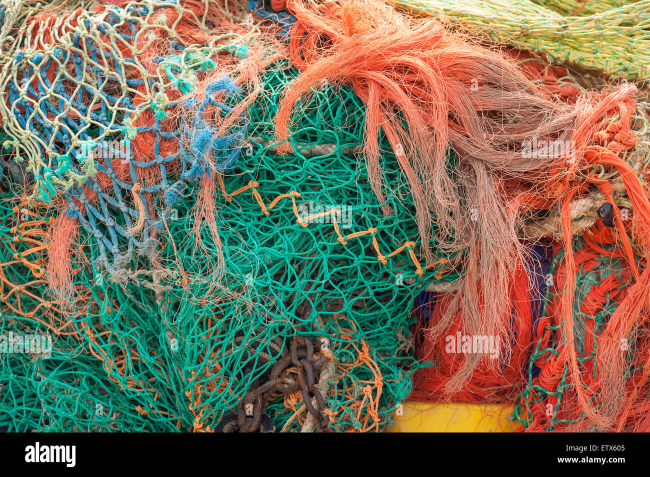 Mass of dry weathered fishing nets with mesh of different sizes a