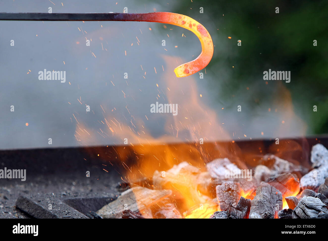 Hannover, Germany, iron rod is heated in the fire Stock Photo