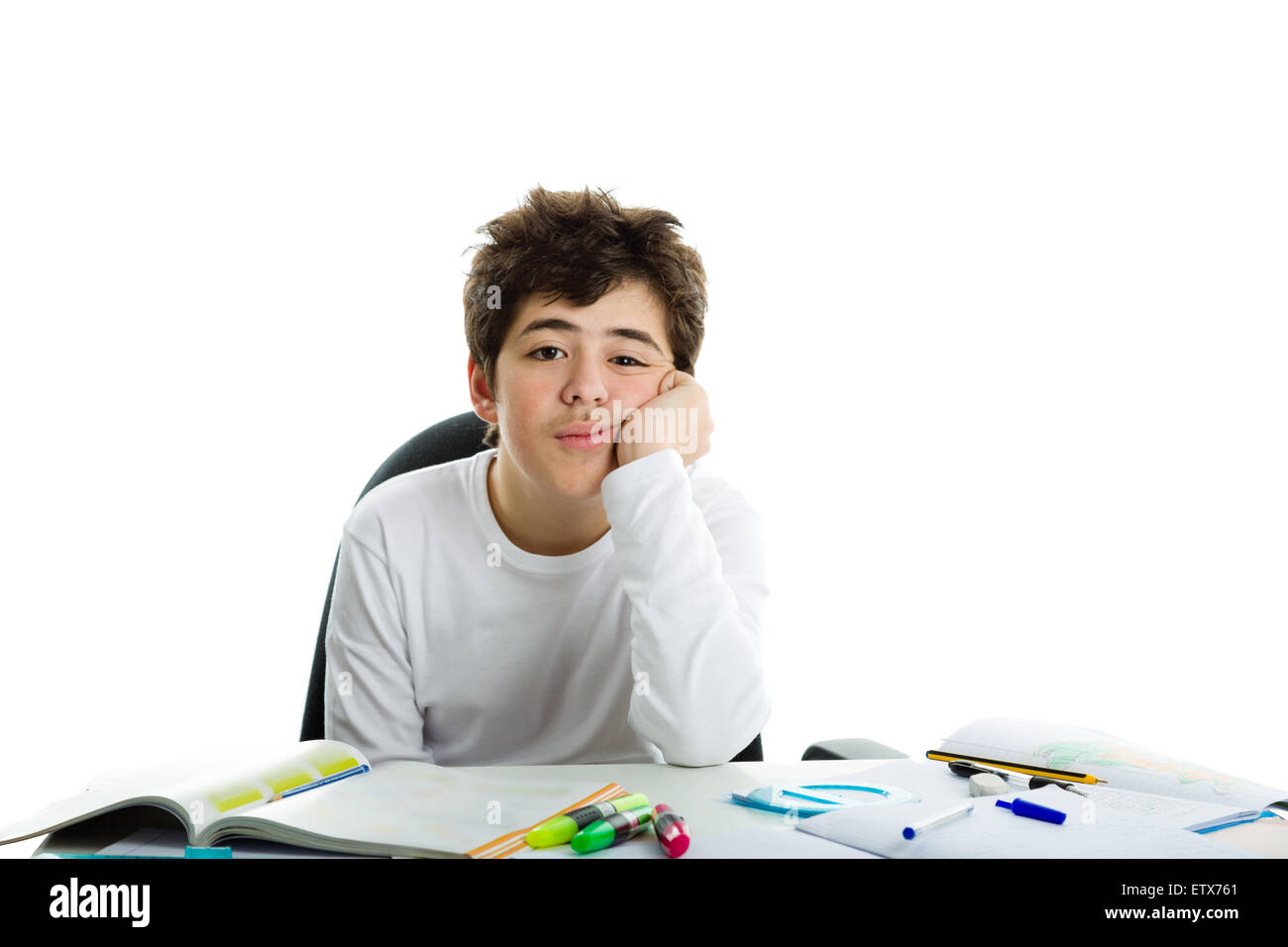 bored Caucasian boy holds his chin with his left hand resting his elbow