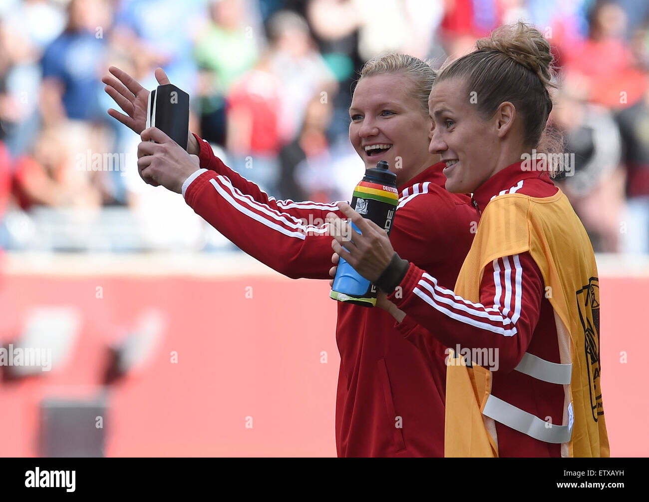 Germany's Alexandra Popp (L) and Simone Laudehr celebrate her victory after the FIFA Women's World Cup 2015 Group B soccer match between Thailand and Germany at the Winnipeg Stadium in Winnipeg , Canada, 15 June 2015. Photo: Carmen Jaspersen/dpa Stock Photo