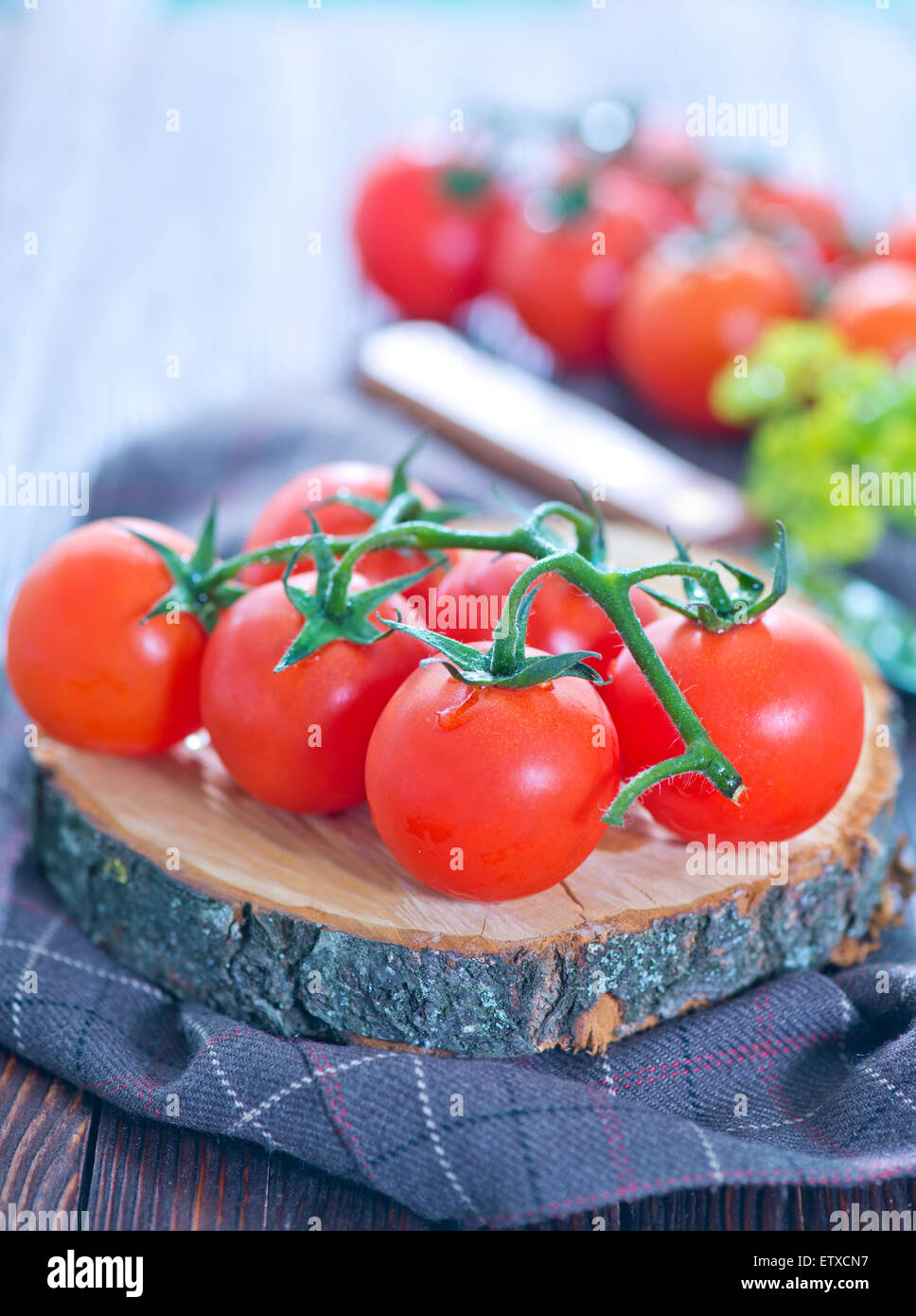 fresh tomato on wooden board and on a table Stock Photo - Alamy