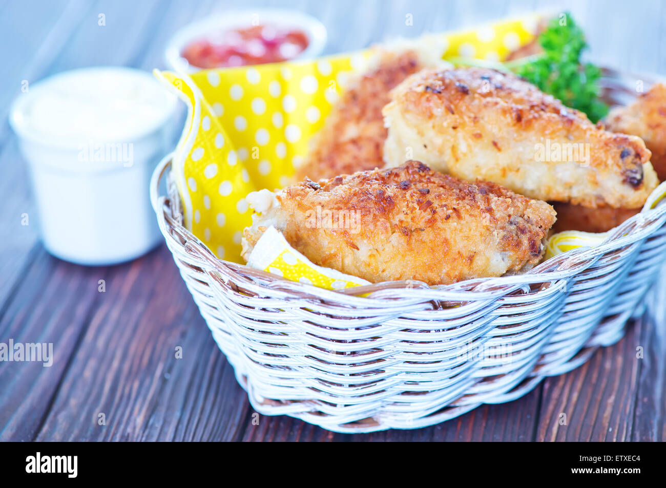 fried chicken wings in basket and on a table Stock Photo Alamy